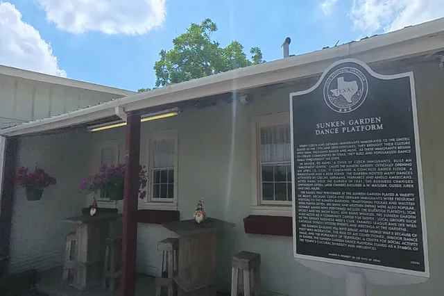 Dewarped 360 audit frame from front approach at 1:08 during the May 25, 2026 Sunken Gardens property walk.