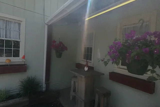 Dewarped 360 audit frame from front approach at 1:28 during the May 25, 2026 Sunken Gardens property walk.