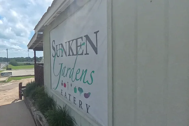 Dewarped 360 audit frame from front approach at 1:38 during the May 25, 2026 Sunken Gardens property walk.