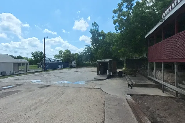 Dewarped 360 audit frame from parking boundary at 3:57 during the May 25, 2026 Sunken Gardens property walk.