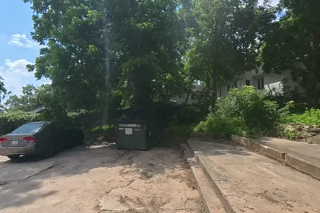 Dewarped 360 audit frame from parking boundary at 4:53 during the May 25, 2026 Sunken Gardens property walk.