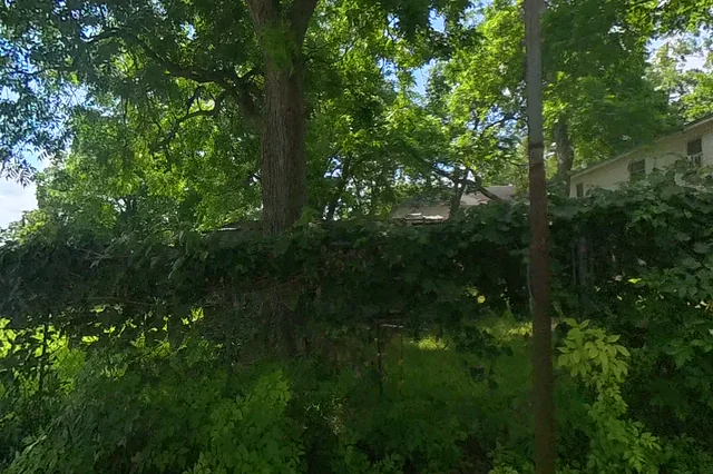 Dewarped 360 audit frame from parking boundary at 5:09 during the May 25, 2026 Sunken Gardens property walk.