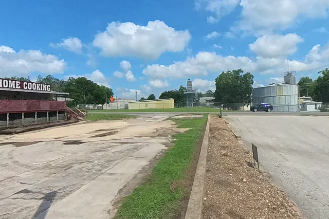 Dewarped 360 audit frame from parking boundary at 5:57 during the May 25, 2026 Sunken Gardens property walk.