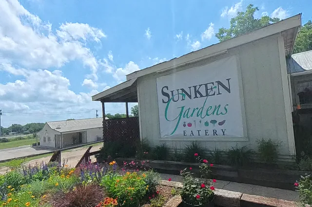 Dewarped 360 audit frame from frontage horseshoe at 7:55 during the May 25, 2026 Sunken Gardens property walk.