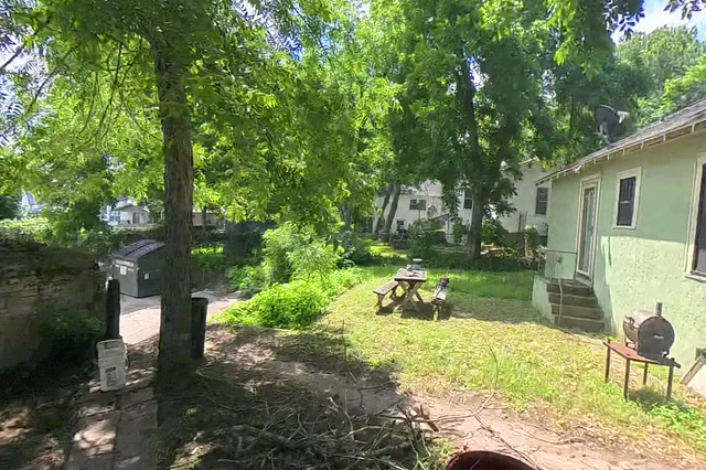 Dewarped 360 audit frame from back garden at 13:37 during the May 25, 2026 Sunken Gardens property walk.